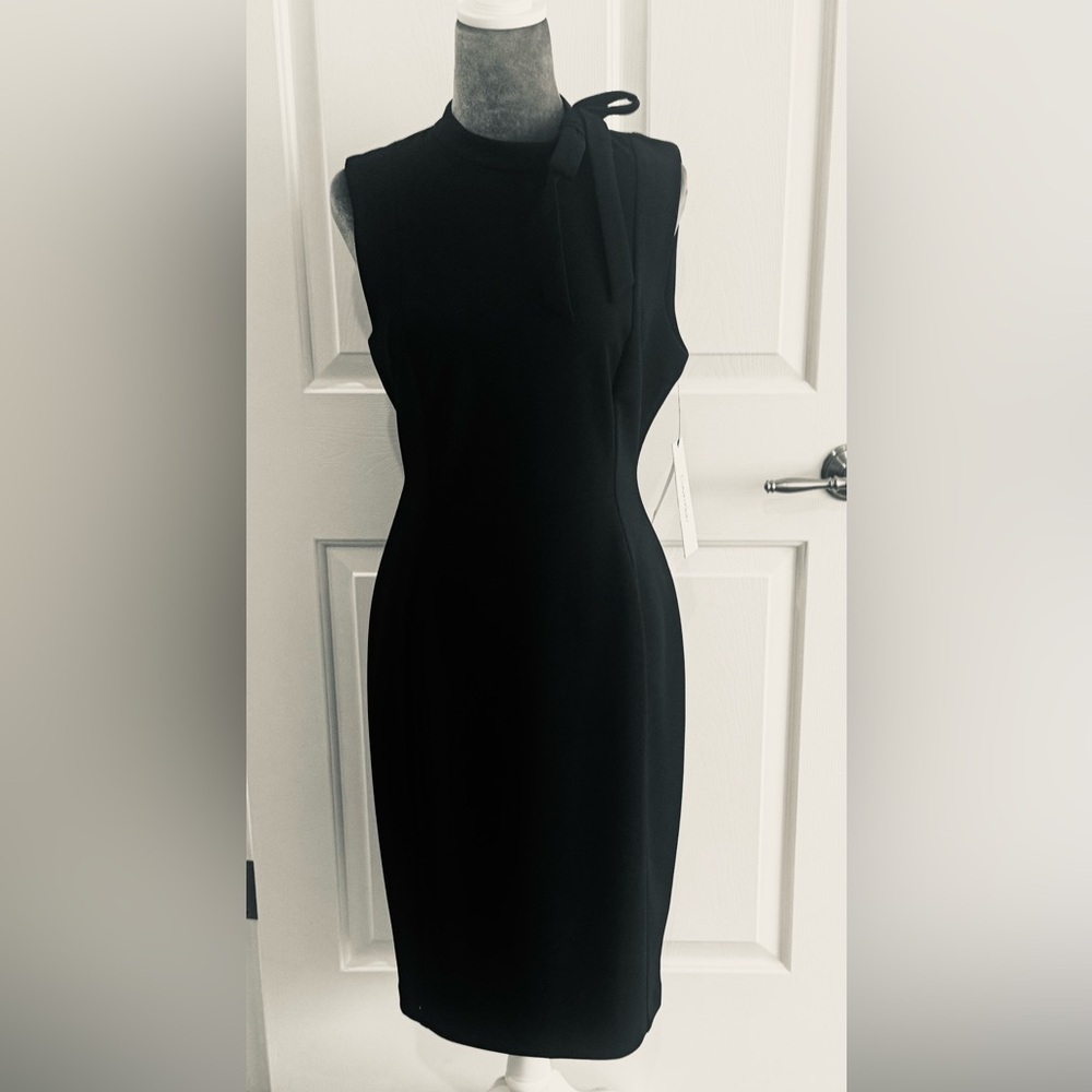 Calvin Klein Midi dress size 10 NWT Black w/Gold Zipper. Bow detail at shoulder